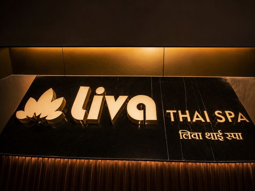 Private massage room with lotus artwork and candlelight at Liva Thai Spa